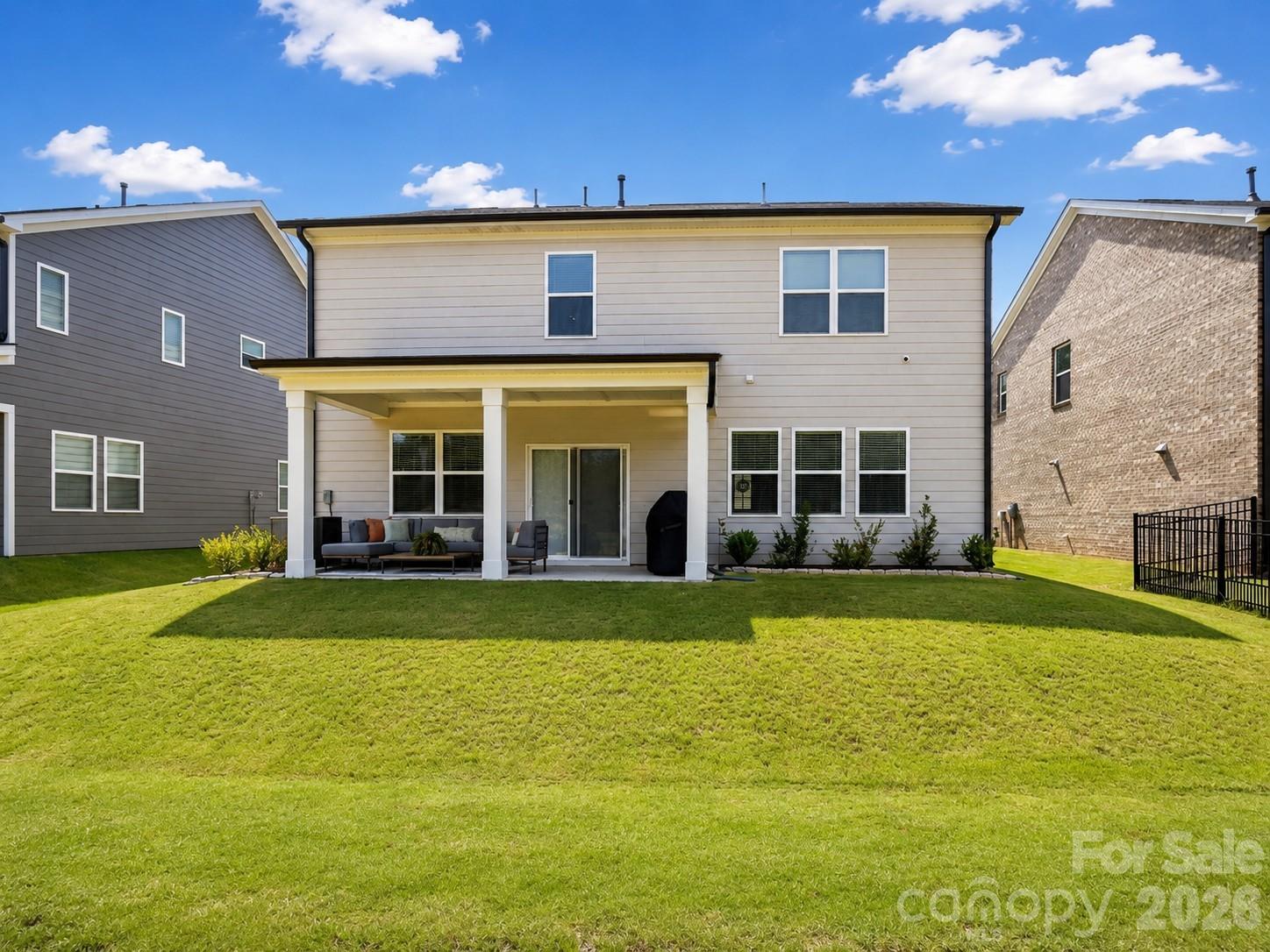 View of yard and back covered patio - 8226 Franklin Trail Street, Mint Hill