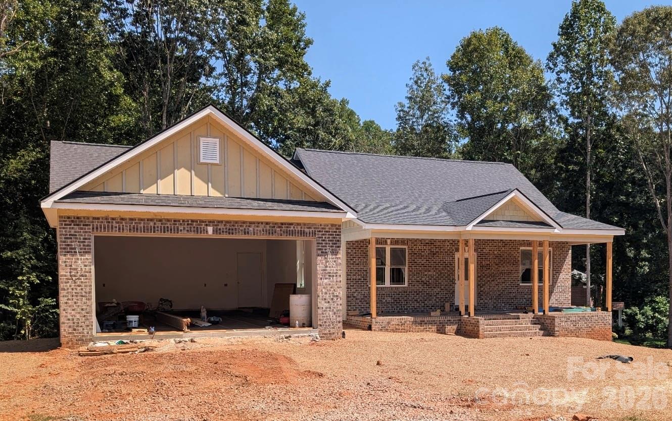 Front view focusing on the over size two car garage - 1895 Knolls Drive, Newton
