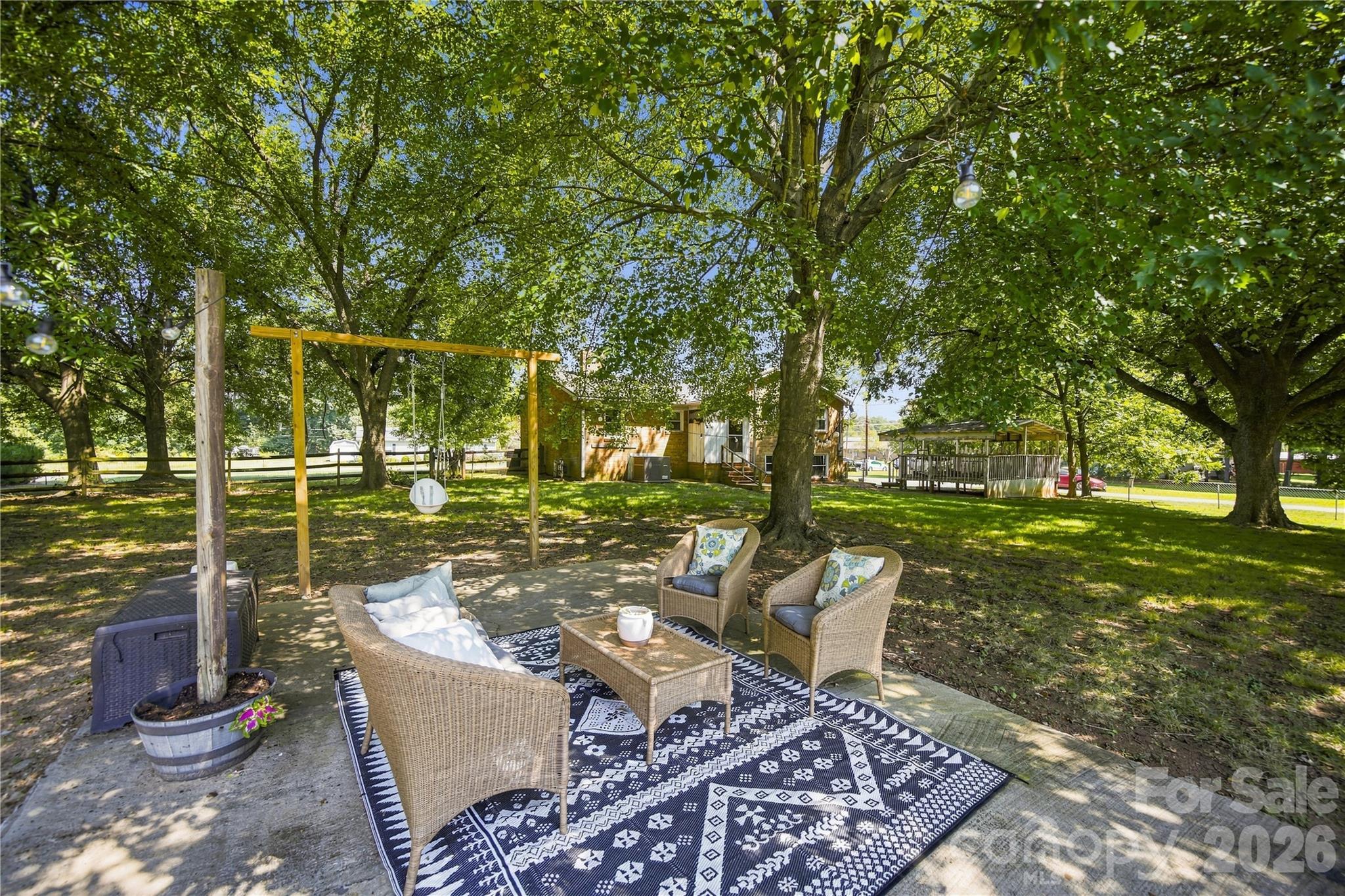Patio in large yard - 7704 Otts Circle, Stanley