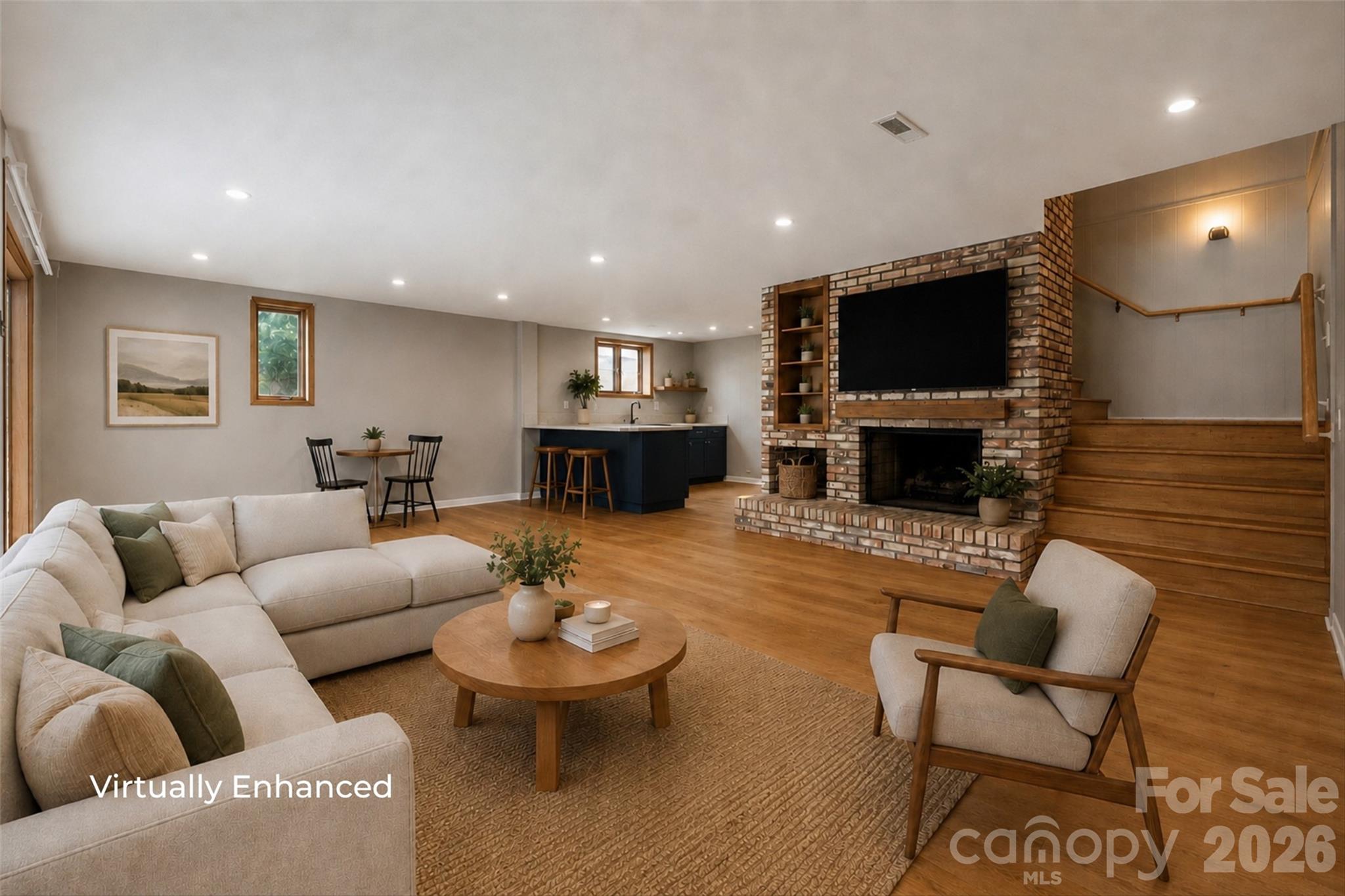Virtually enhanced basement living area with fireplace - 131 Baywatch Drive, Mooresville