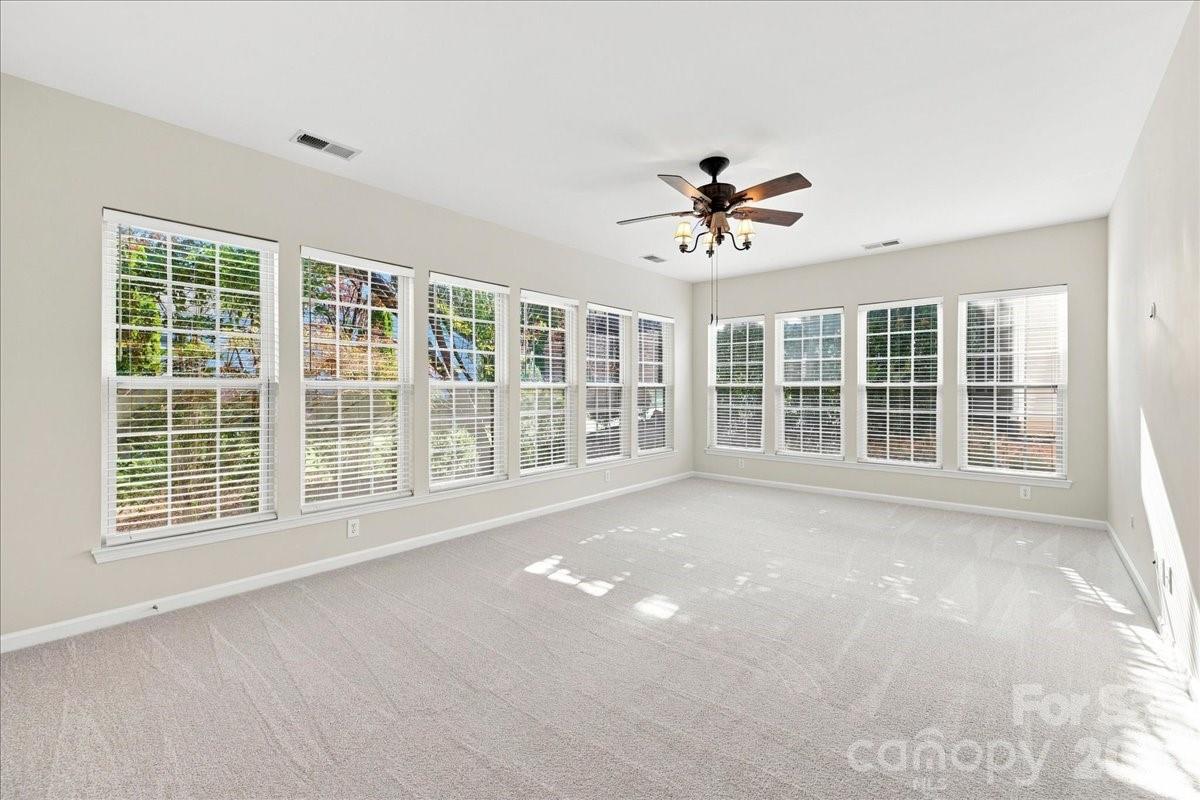 Sunroom Large Windows allow Natural Light to Filter in - 36145 Watsonia Street, Indian Land