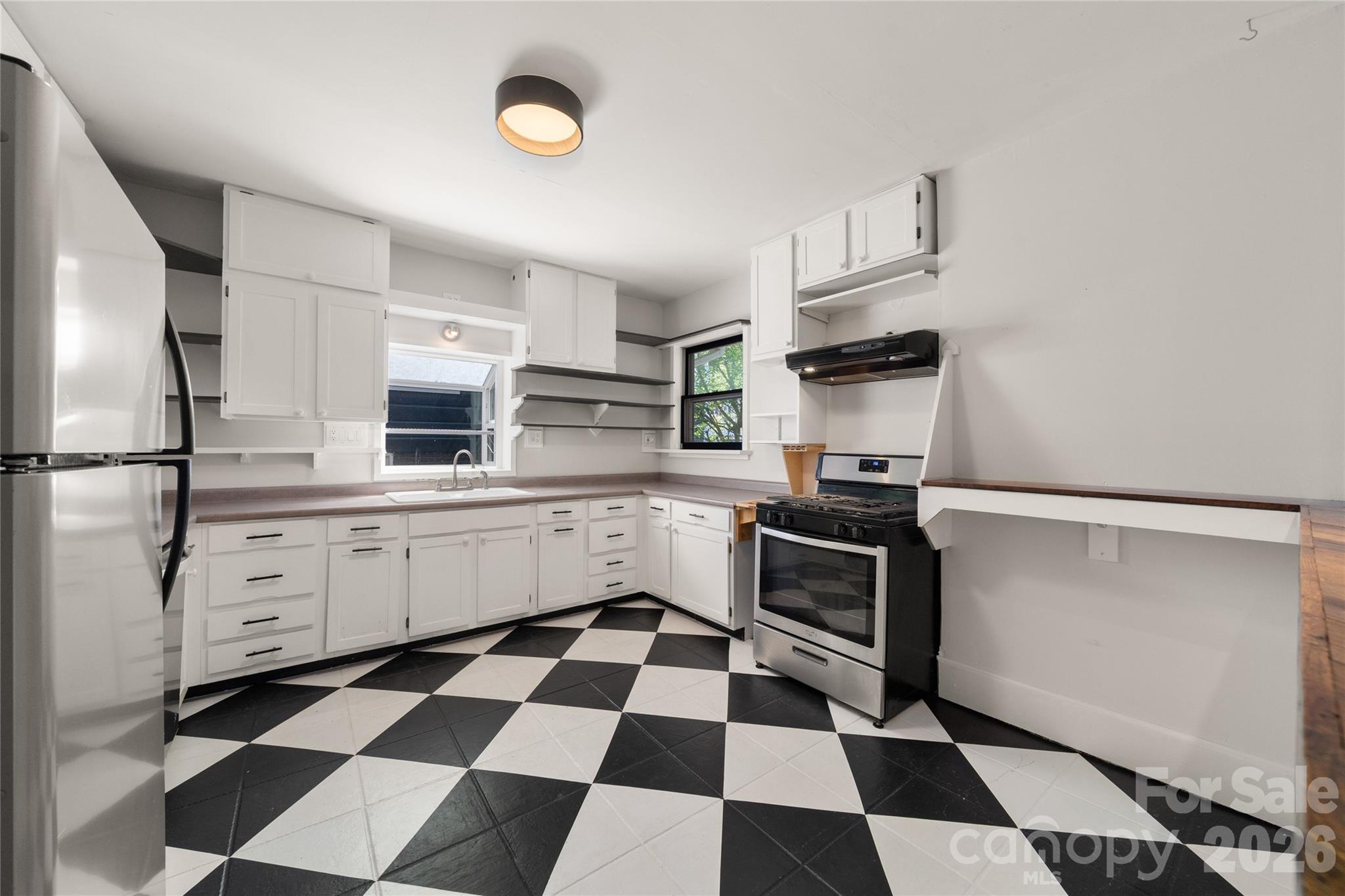 Such a bright, happy kitchen flooded with light from three windows - 101 Olney Road, Asheville