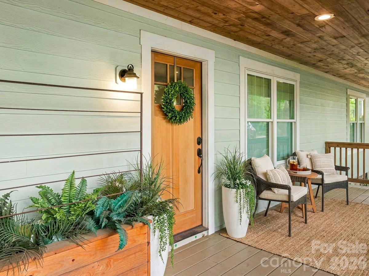 Virtually staged covered front porch - 141 Courtland Avenue, Asheville