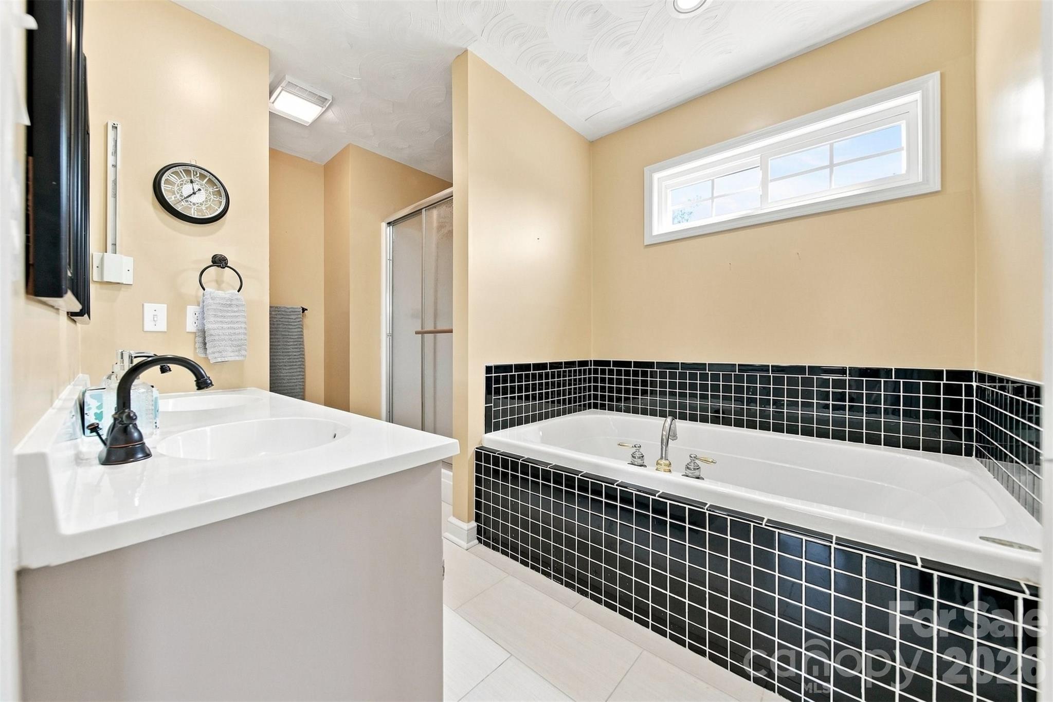primary bath in primary bedroom on main - 4948 Betty Drive NE, Hickory