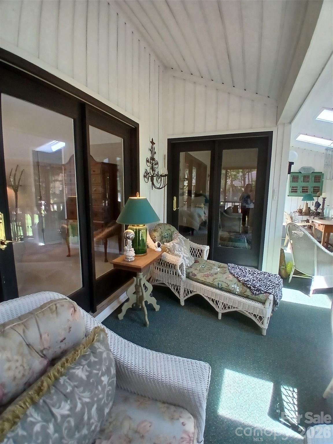 Outdoor screened in porch with slide doors tot primary bdrm. - 304 red oak Drive, Hendersonville