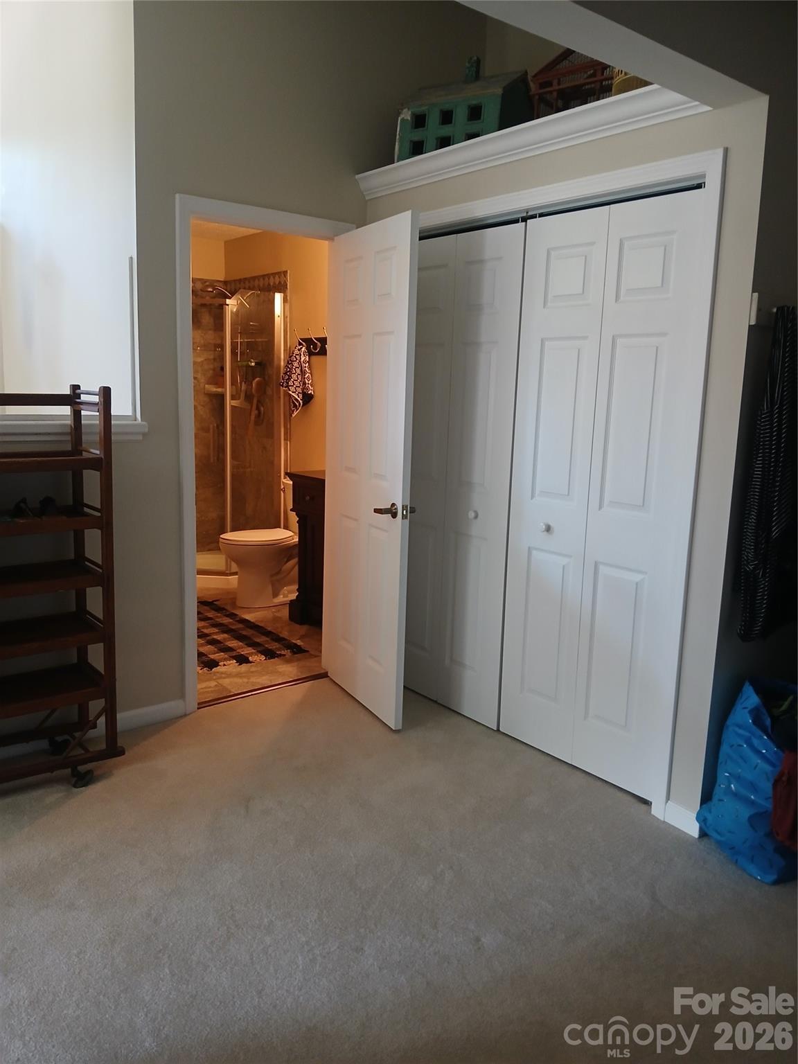 Sitting area in loft looking into bath and closets - 304 red oak Drive, Hendersonville