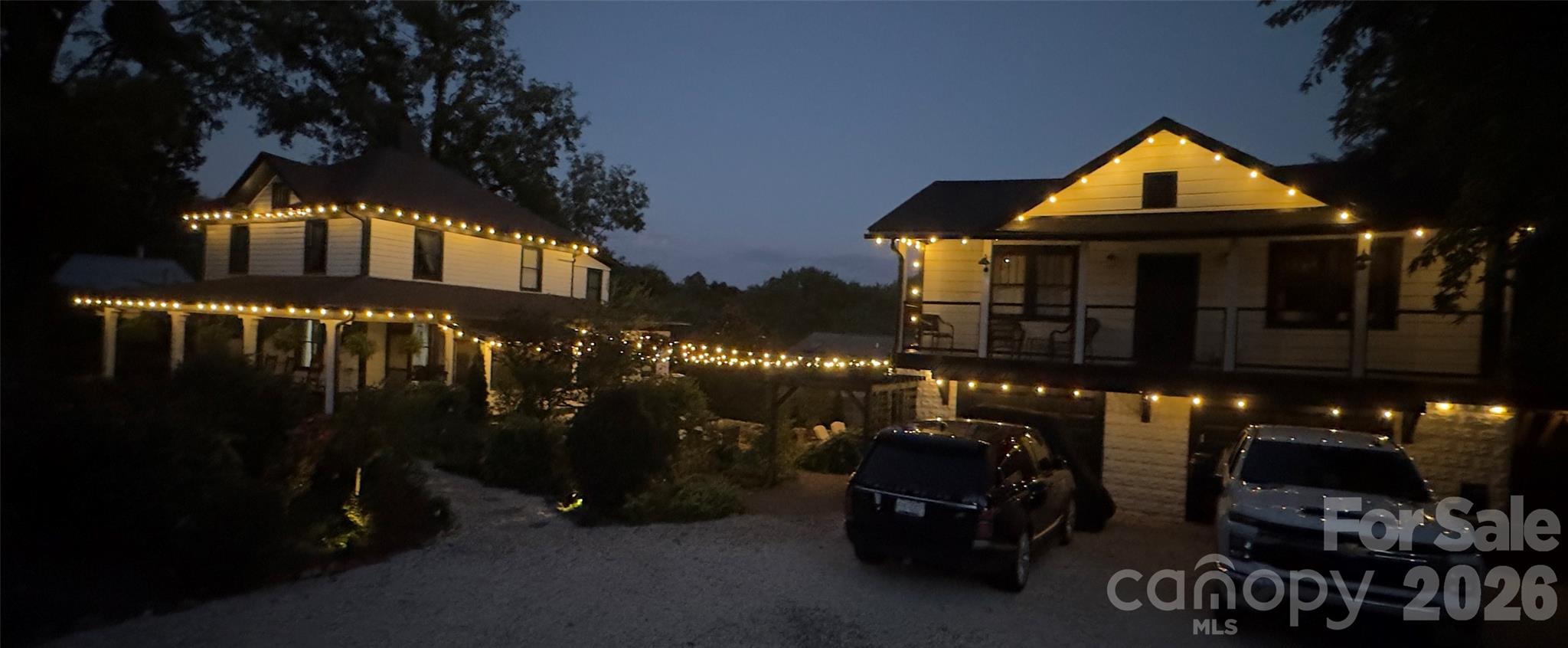 View of the home and 2nd living quarters at night. - 293 Fairview Road, Asheville