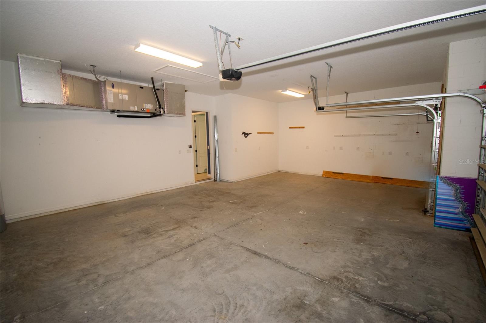 Oversized three-car garage. - 225 BIRCHWOOD DR, PALM COAST