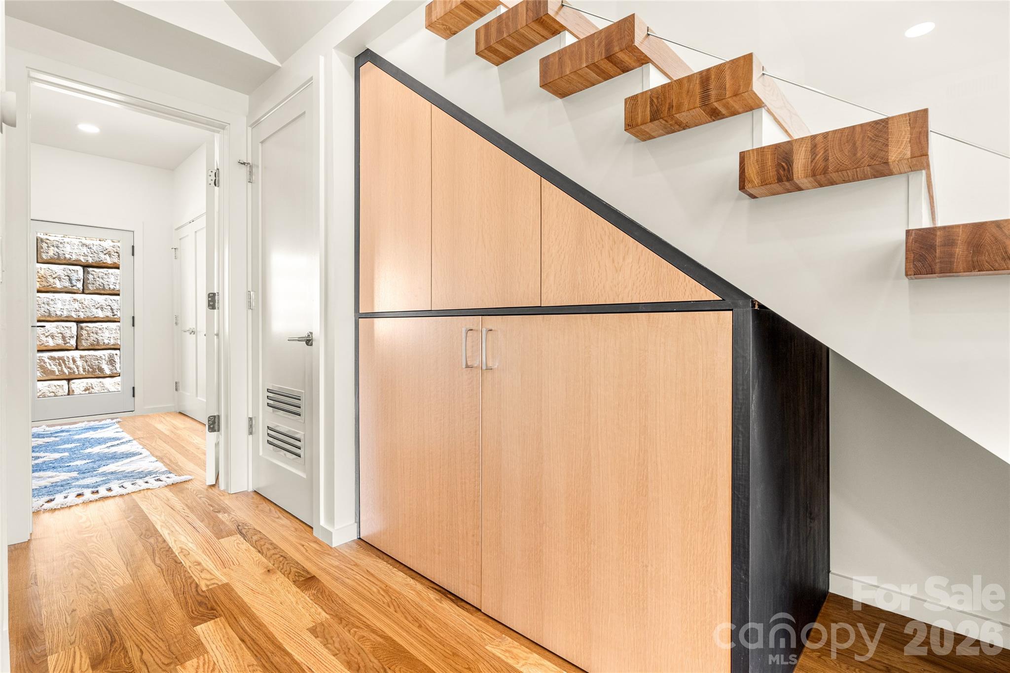 Built ins and laundry under the stairs. - 4 Roberts Street, Asheville