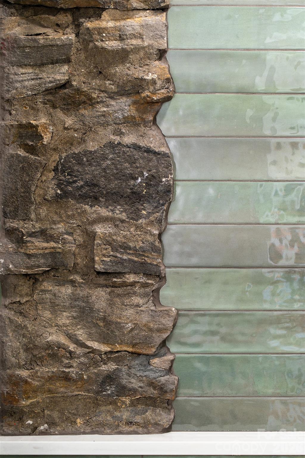 Original fieldstone pillars incorporated into the modern design. - 4 Roberts Street, Asheville