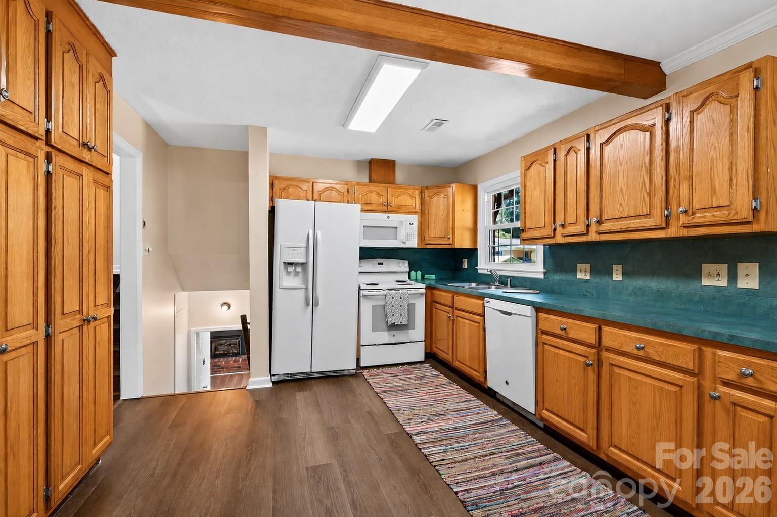 Large eat-in kitchen (NOTE: ONE CABINET DOOR IS MISSING AND IN THE PROCESS OF BEING REPLACED...PHOTO EDITED TO INCLUDE DOOR) - 2 Independence Boulevard, Asheville