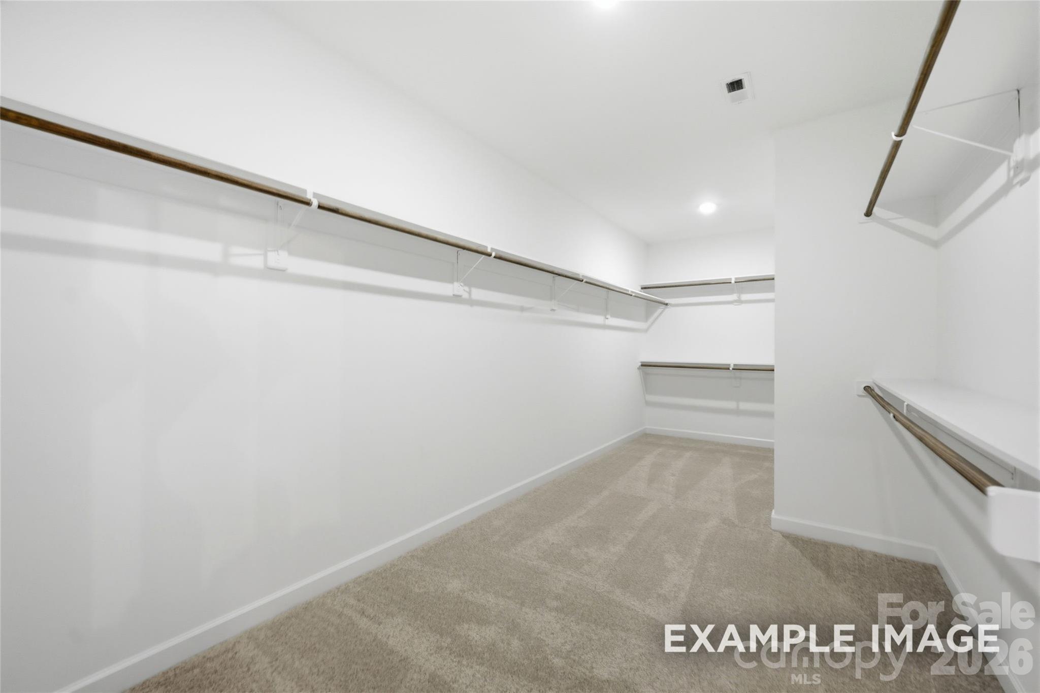 sample photo of owner's walk-in closet - 2919 Audubon Ridge Drive, Belmont