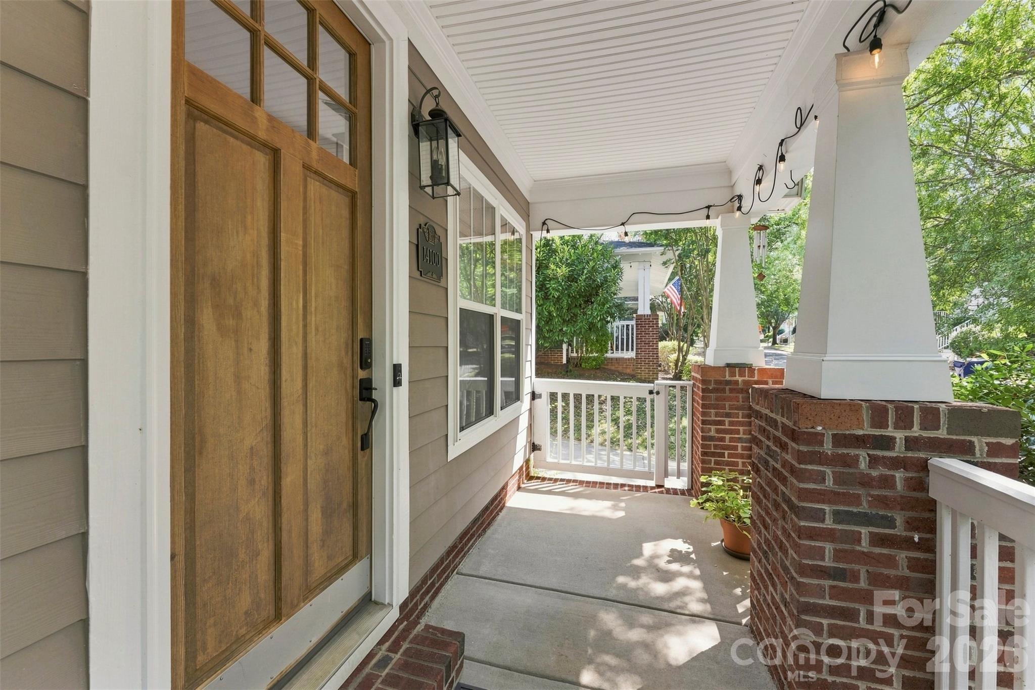 Shaded and welcoming front porch - 14100 Garden District Row, Huntersville