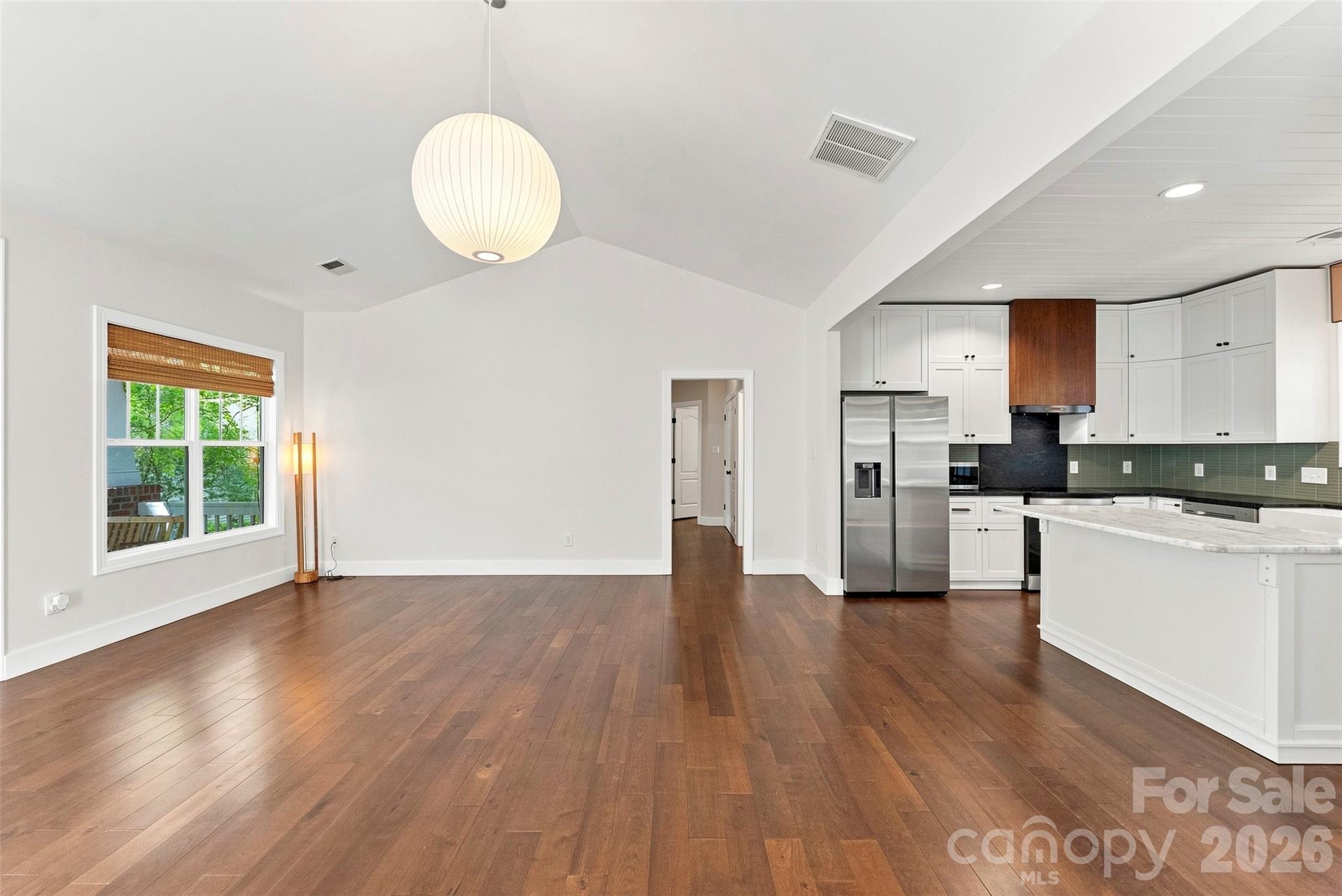 Open-concept living and kitchen area - 14100 Garden District Row, Huntersville