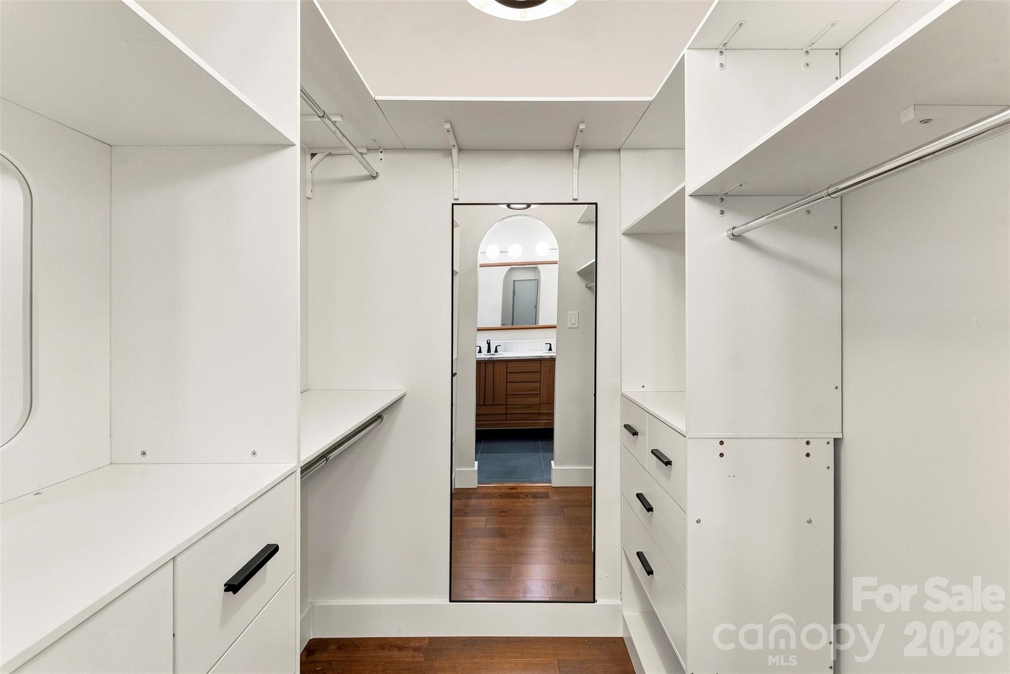 Spacious walk-in closet with built-in storage - 14100 Garden District Row, Huntersville