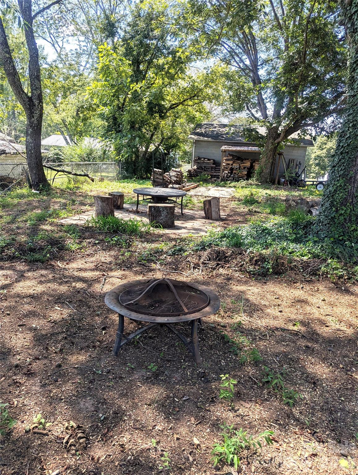 firepit under the shade of pecan treees - 605 Lincoln Lane SW, Lenoir