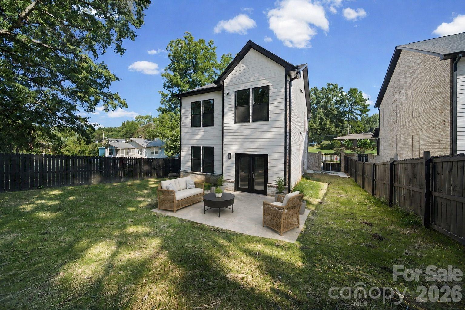 Beautiful custom brick and wood fenced in yard.  Virtually staged furniture patio - 1445 Kingsley Drive, Albemarle