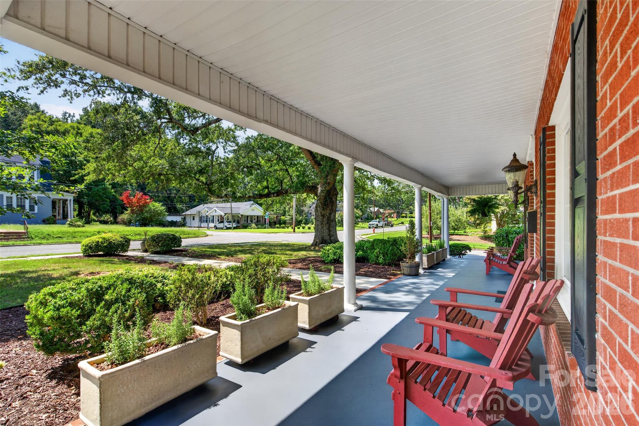 The expansive covered front porch offers plenty of room to sit, relax, and enjoy. - 638 Carolina Avenue, Gastonia