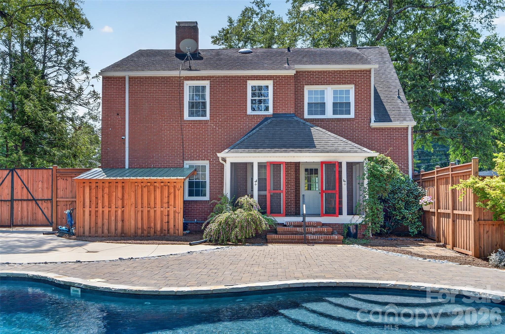 Rearview of the home overlooking the pool and expansive outdoor living area. - 638 Carolina Avenue, Gastonia