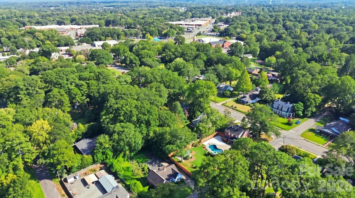 A wider aerial view highlights the scale of the property and its mature tree canopy, offering a perspective you simply can't appreciate from ground level. - 638 Carolina Avenue, Gastonia