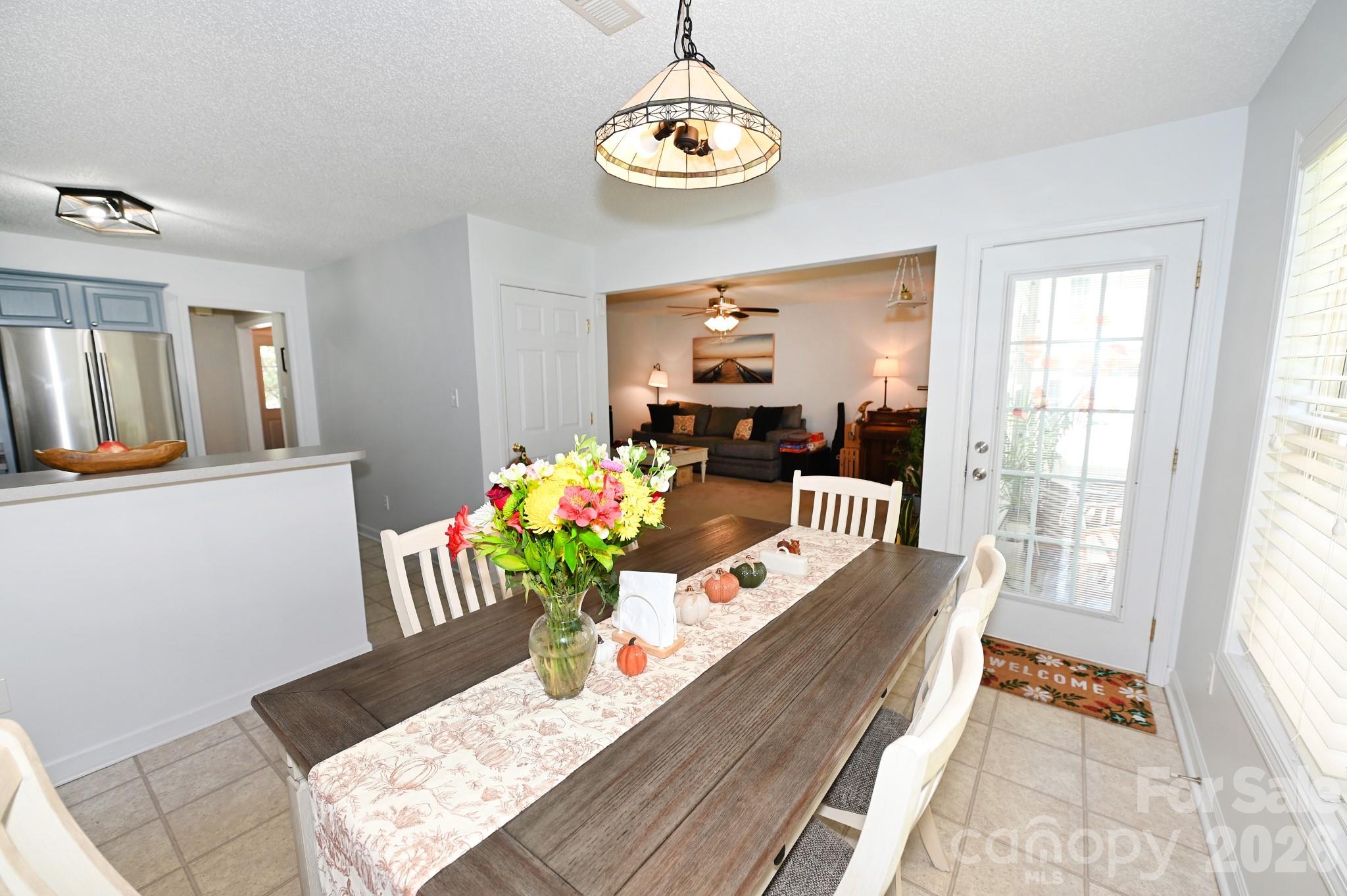 Dining area with doorway to the screened in porch - 236 17th Avenue SE, Hickory