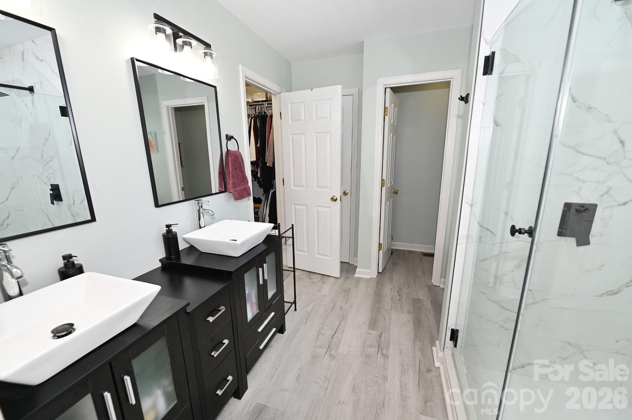 Primary bathroom-door to the left, walk in closet-door to the right toilet(water closet) - 236 17th Avenue SE, Hickory
