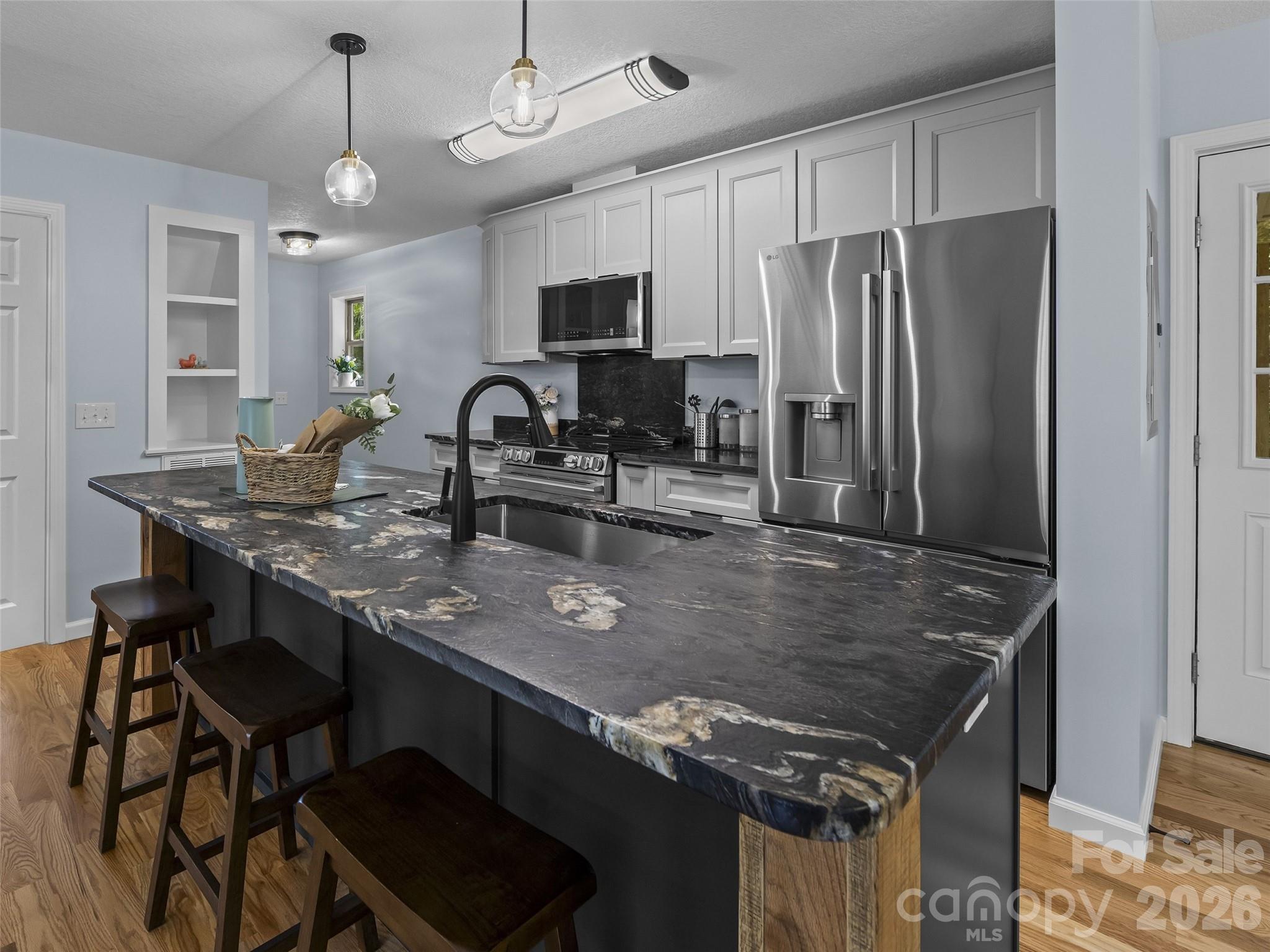 Lethered finishing granite island. - 214 Aster Ridge Drive, Waynesville