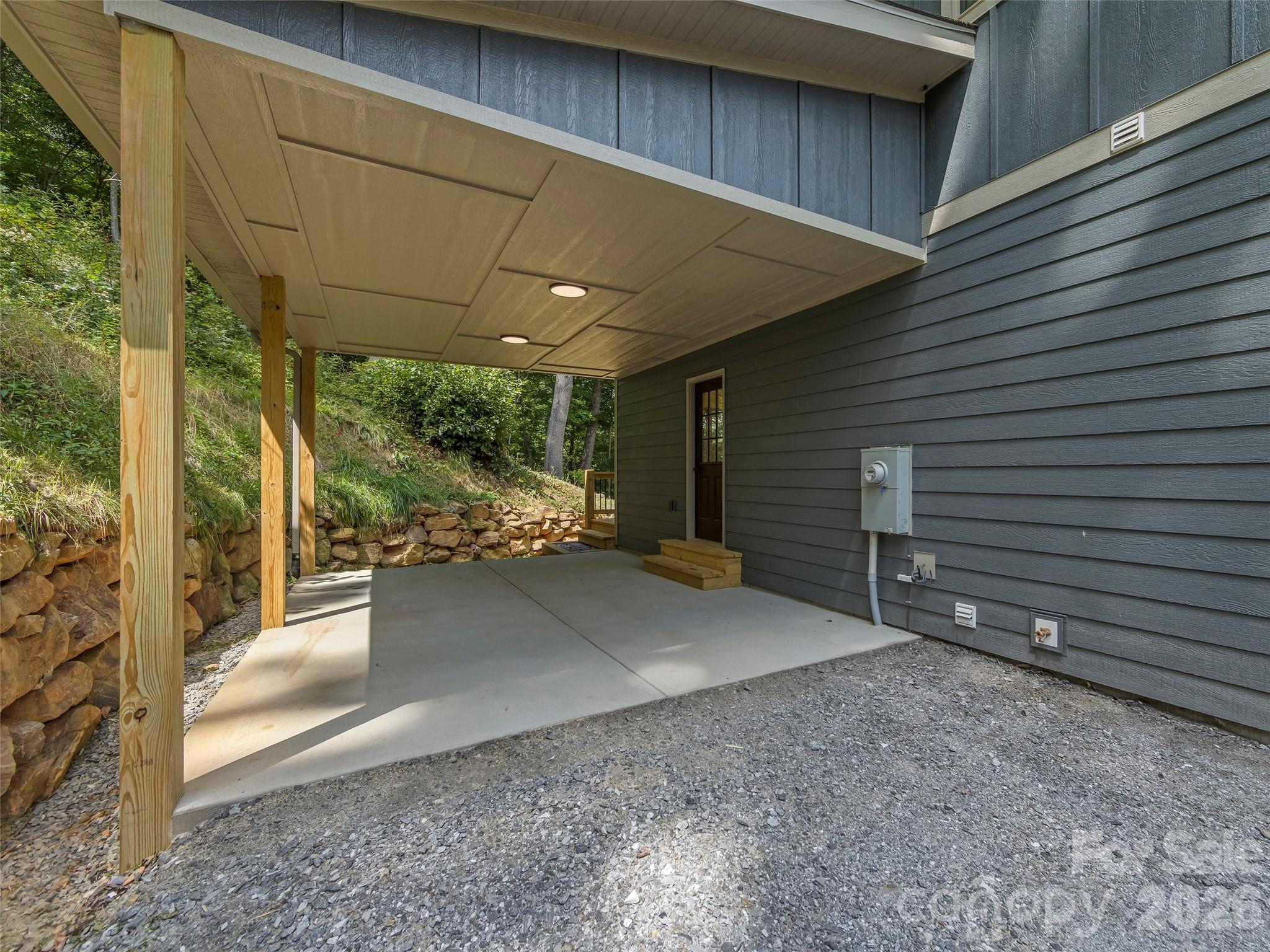 Carport that is wired to be easily converted to garage - 214 Aster Ridge Drive, Waynesville