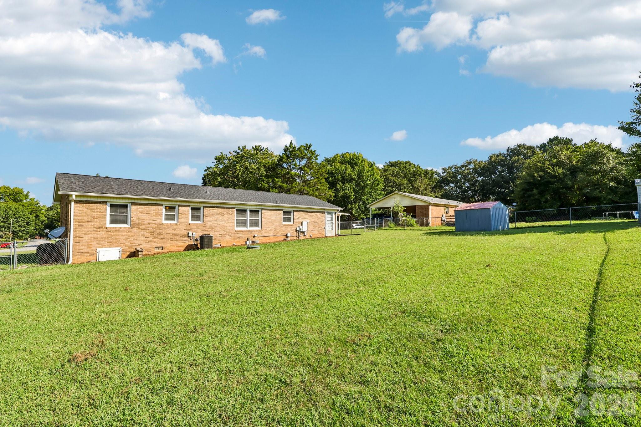 Flat Backyard with storage shed - 5111 Hawthorne Lane, Shelby