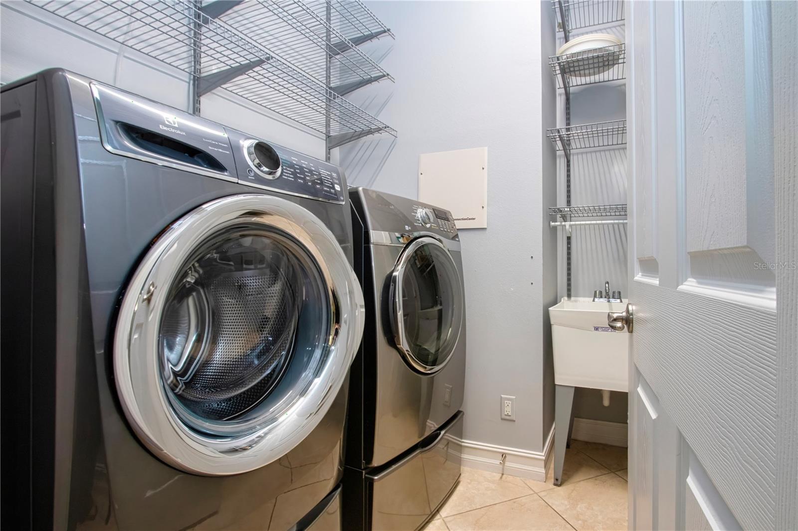 Inside Utility Room w/laundry tub & lots of storage - 15847 COBBLE MILL DR, WIMAUMA