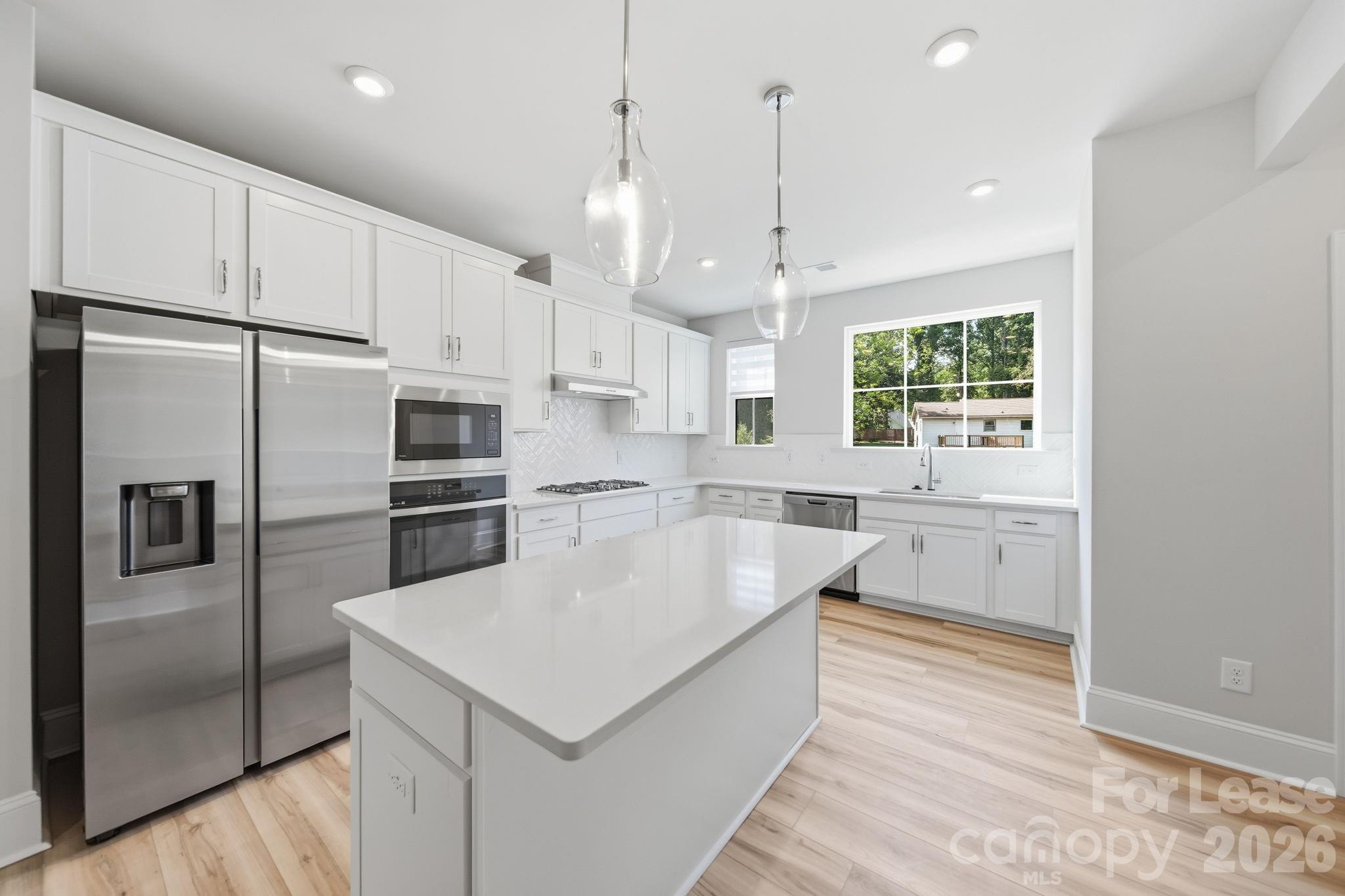 Corner Kitchen with lots of counter/cabinets space - 424 Old Town Village Road, Waxhaw