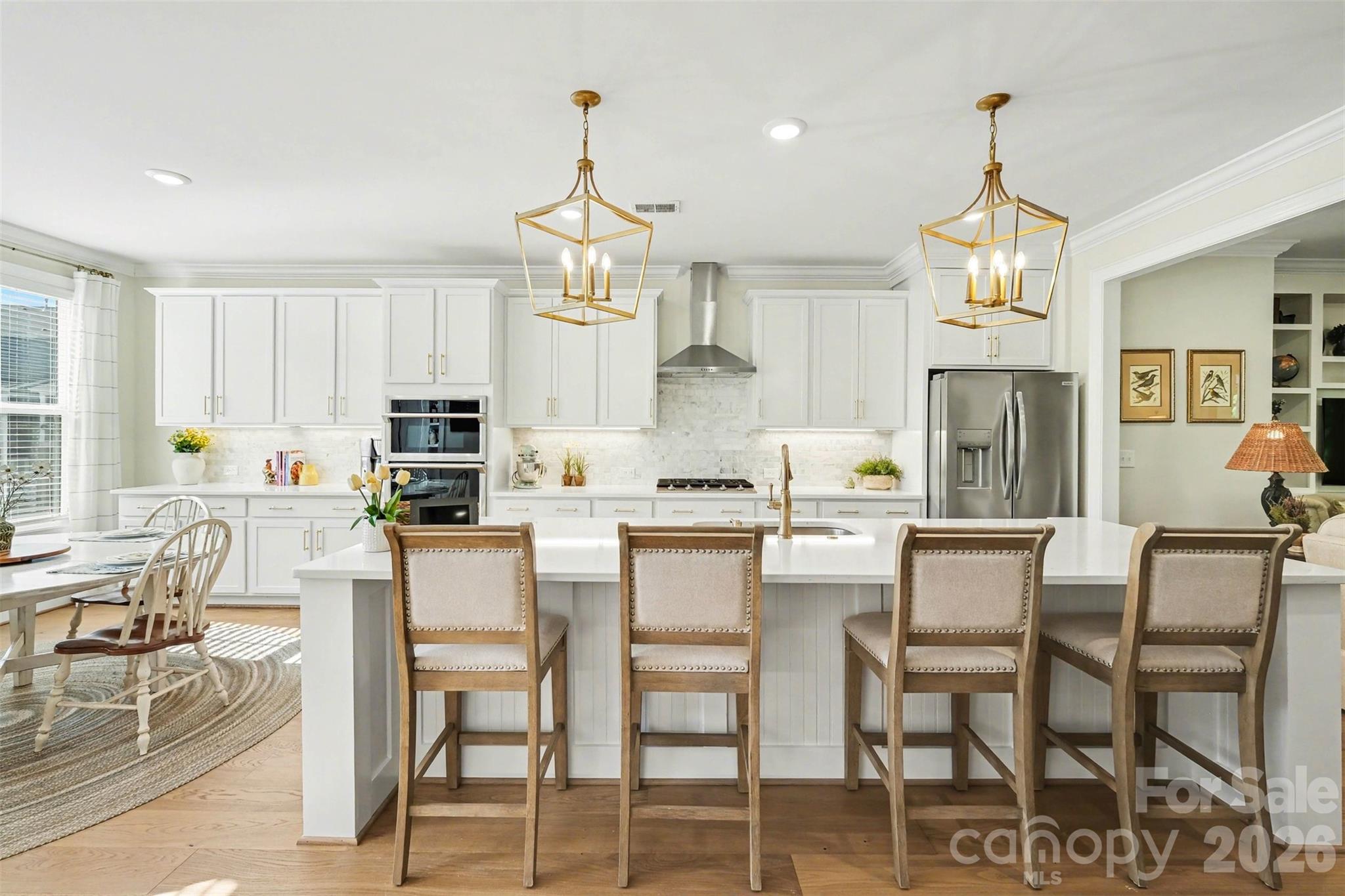 Spacious and modern kitchen with island, as well as a dining area. - 3743 Keyworth Way, Indian Land