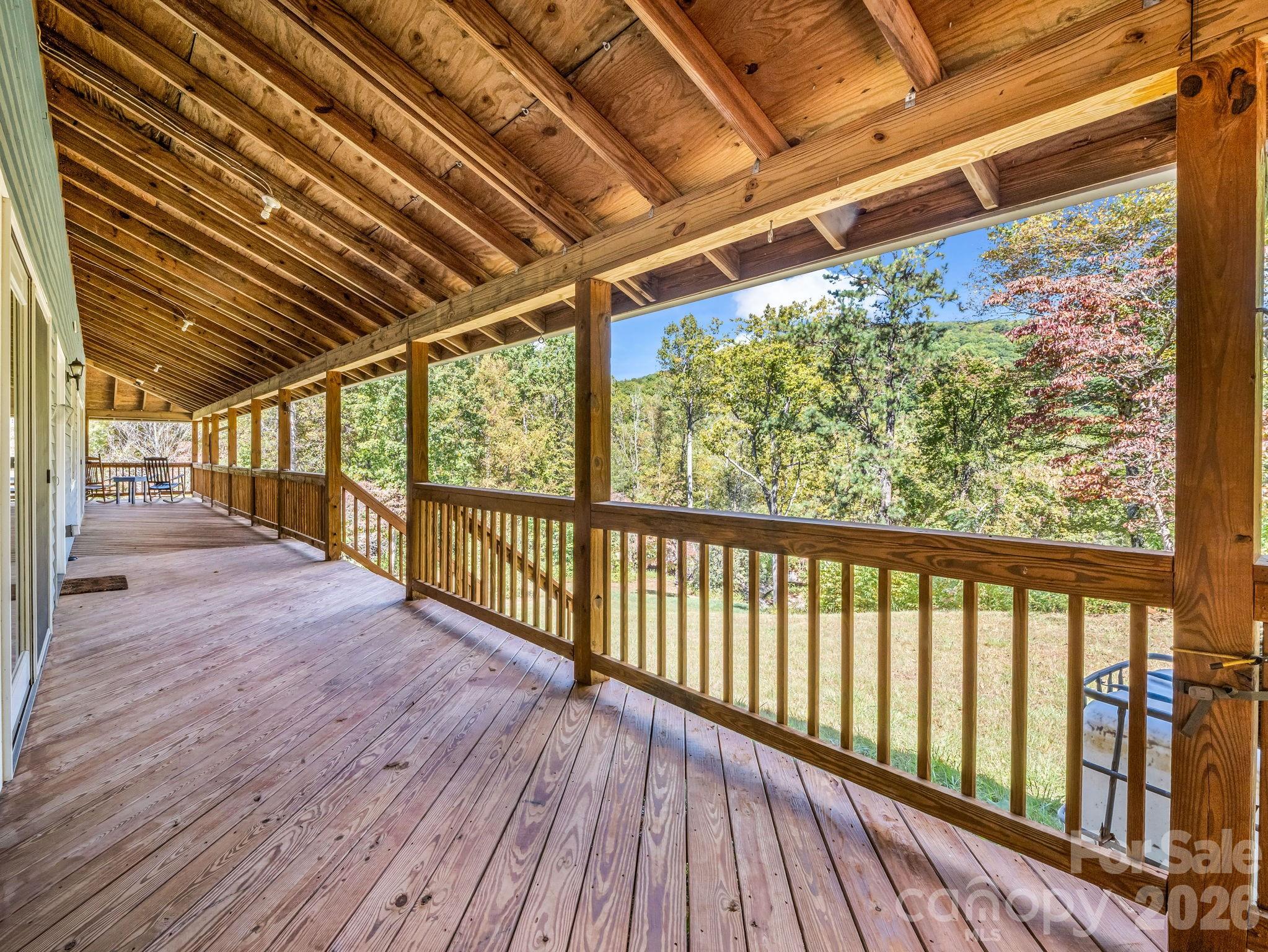 Covered porch facing stream, pool & Covered porch facing clubhouse, stream, pool & waterfall - 119 Mountain Bluff Trail, Hendersonville