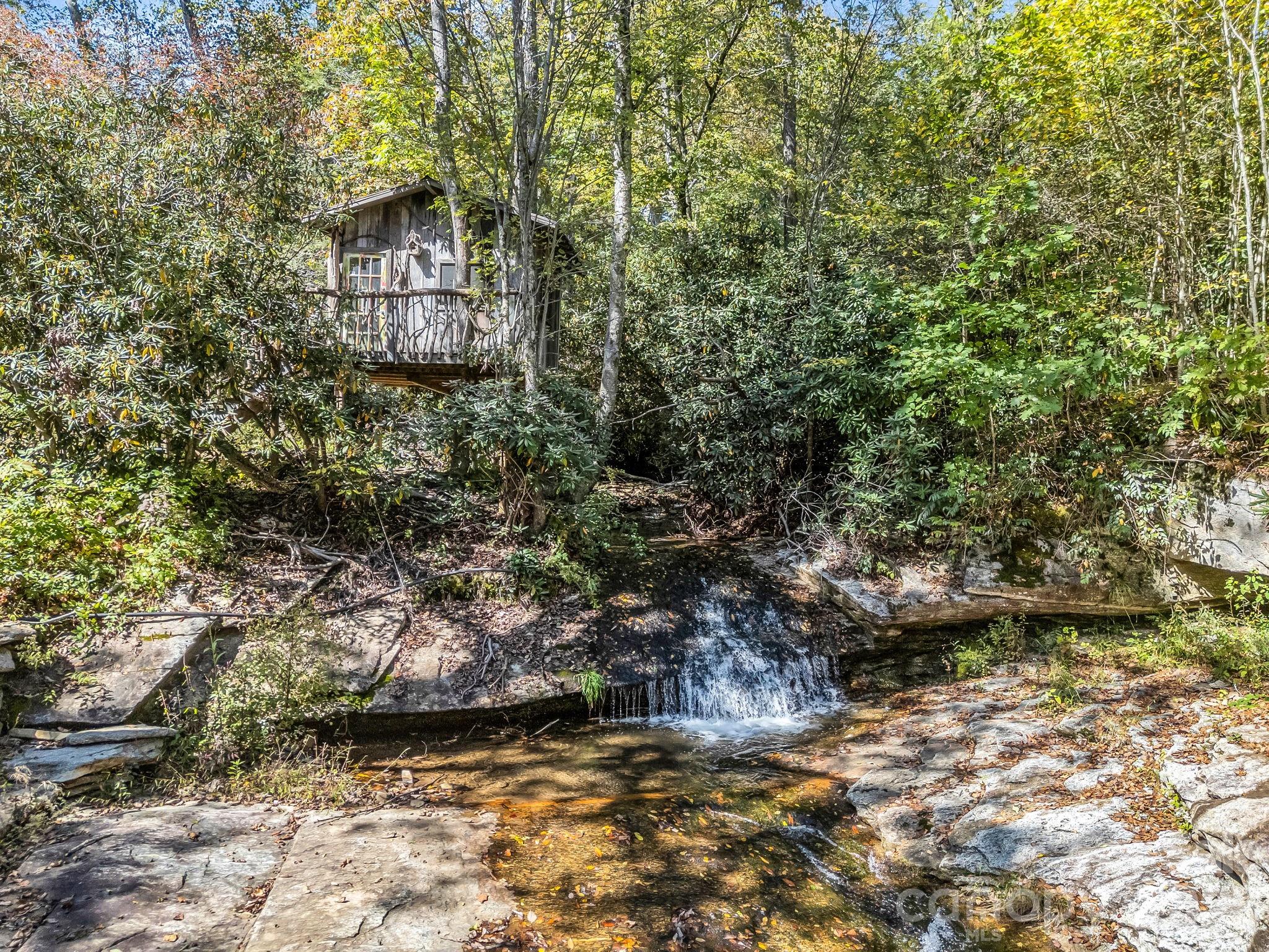 Clubhouse overlooking the stream that becomes cascading waterfall - 119 Mountain Bluff Trail, Hendersonville
