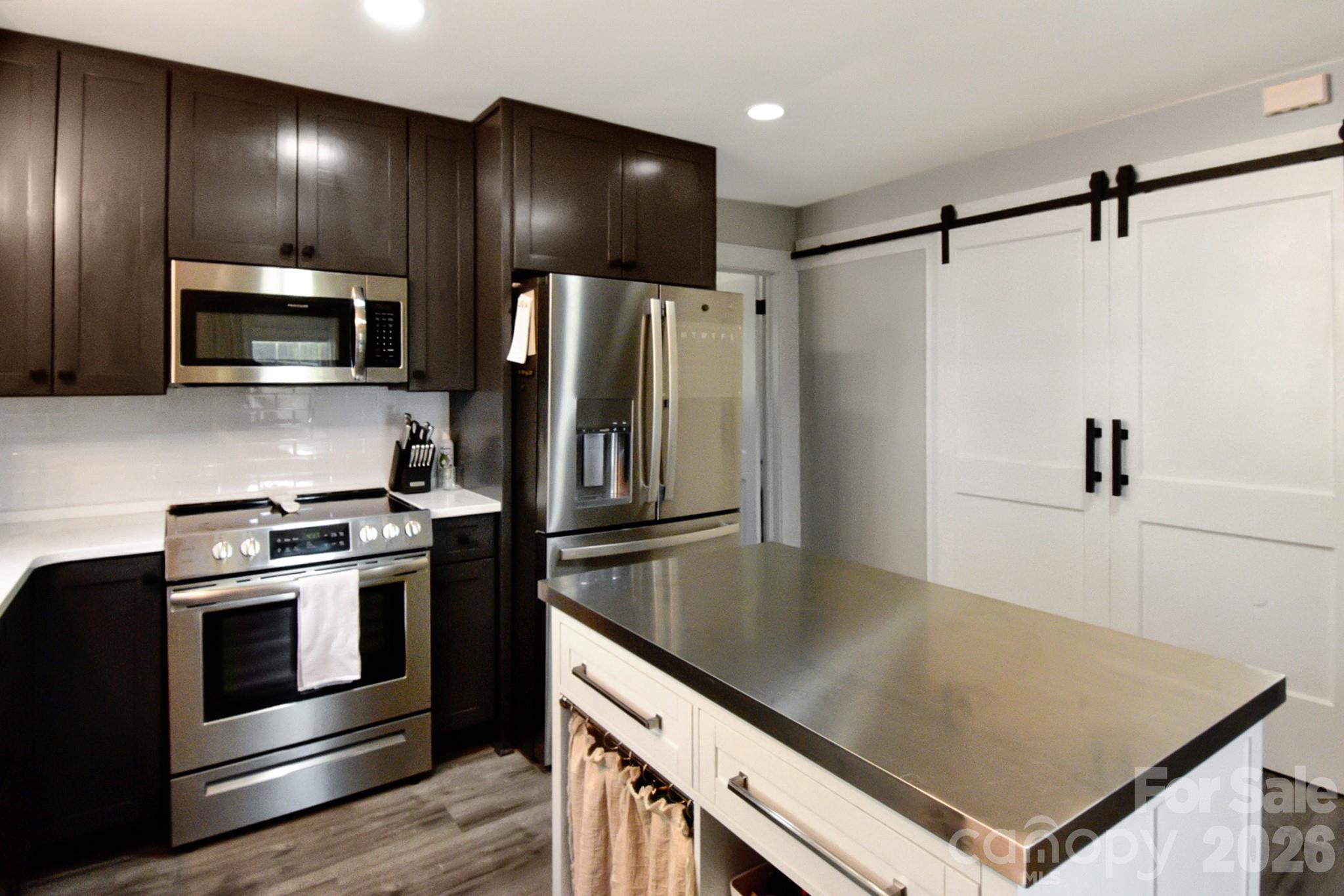 Kitchen with stainless appliances - 541 Perry Road, Troutman
