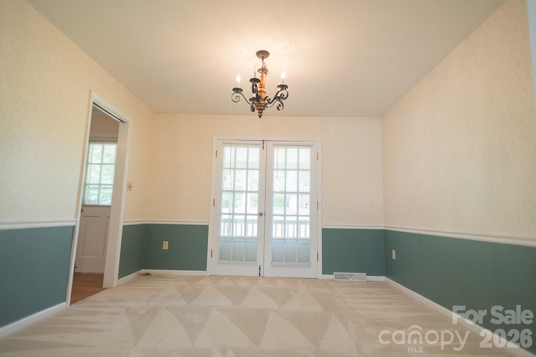 Dining Room that open to the deck through the double doors - 3401 Tracelake Drive, Matthews
