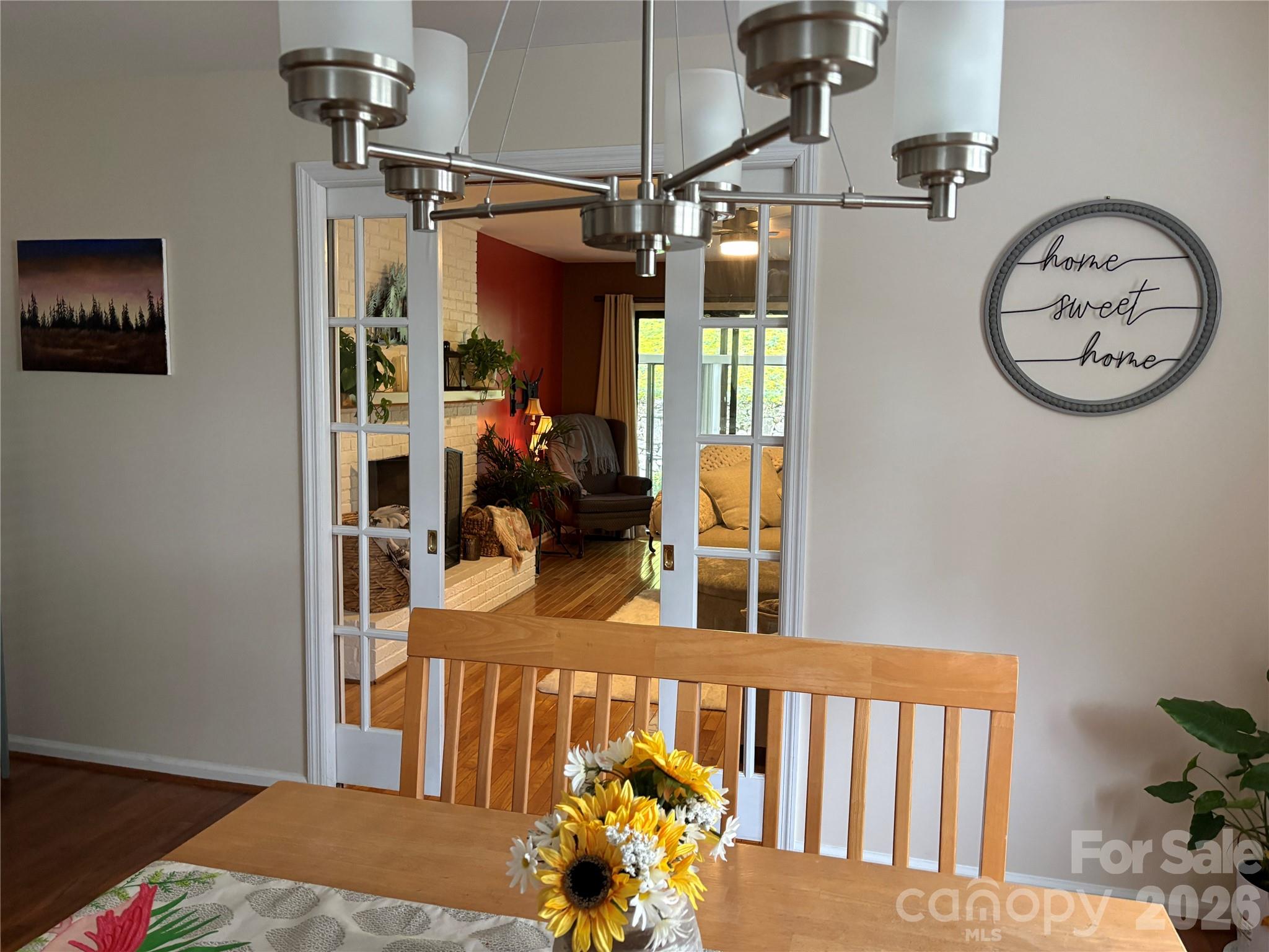 Two pretty 12 lite glass pocket doors located between large dining area & Living room - 610 Britton Creek Drive, Hendersonville