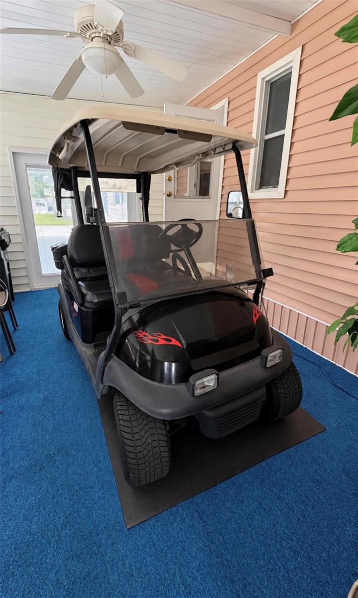 Enclosed lanai holds golf cart when on vacation - 1100 BELCHER RD S #535, LARGO