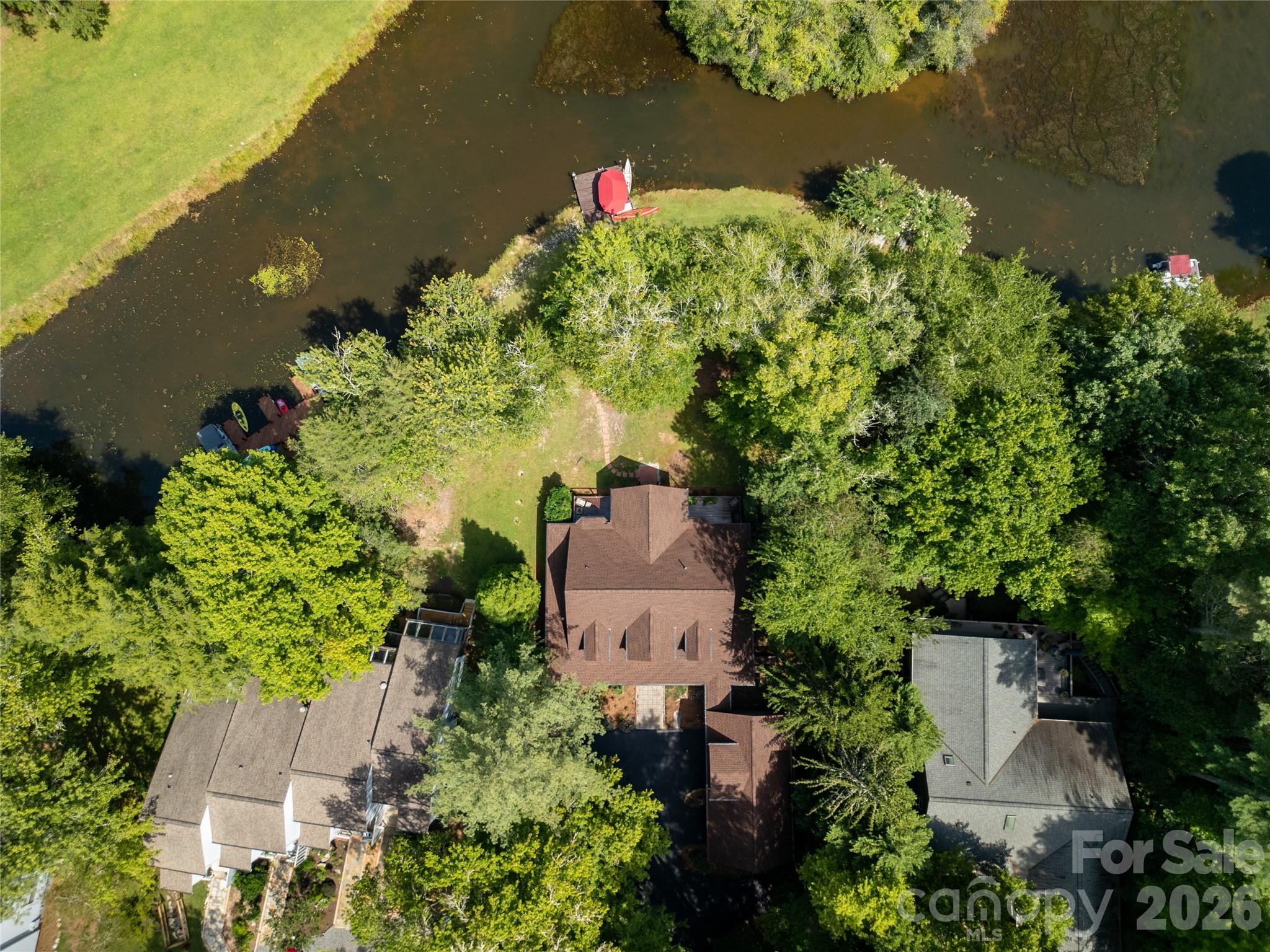 Located on the "Little" portion of  Lake Atagahi with a level lot to the lake - 111 Kanunu Court, Brevard
