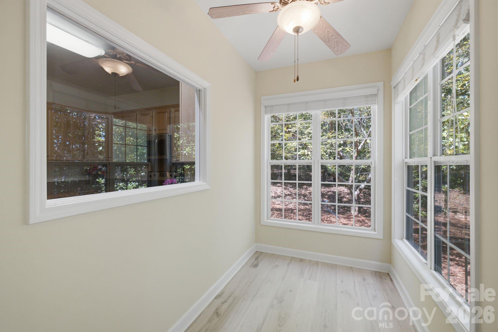 Sunroom designed for relaxation and peaceful downtime. - 14724 Beatties Ford Road, Huntersville