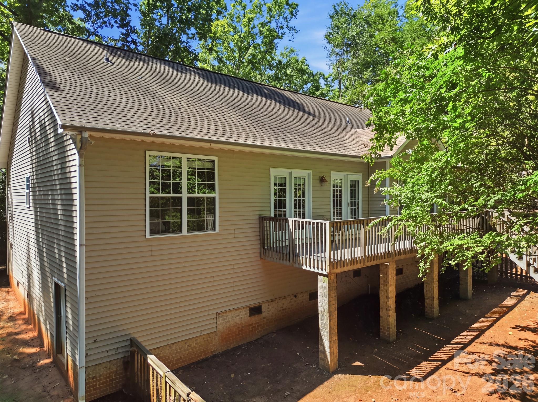 Back and side view of the home exterior. - 14724 Beatties Ford Road, Huntersville