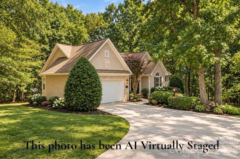 Virtually staged front exterior with Landscaping and driveway - 14724 Beatties Ford Road, Huntersville