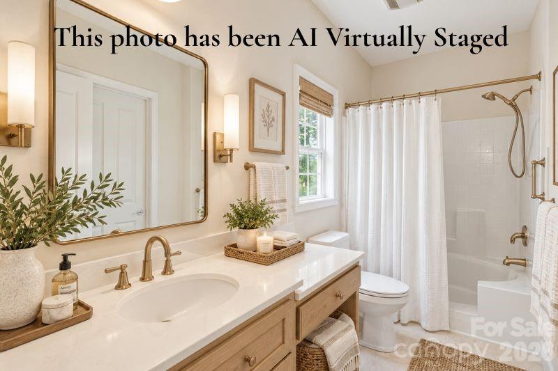 Virtually Staged Spacious primary bathroom featuring an elegant soaking tub - 14724 Beatties Ford Road, Huntersville