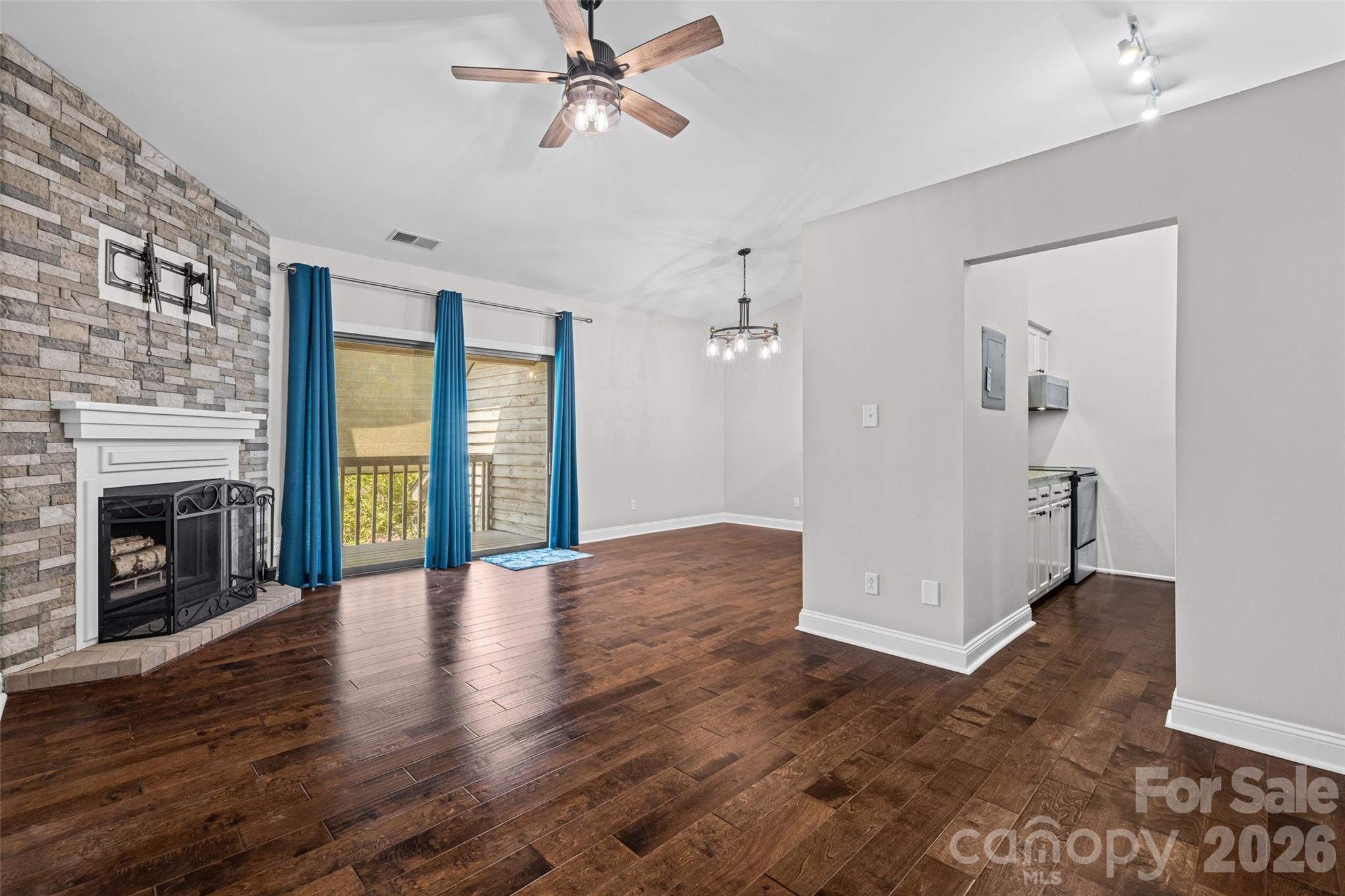 Open concept living/dining with wood burning fireplace - 4160 Charlotte Highway, Lake Wylie