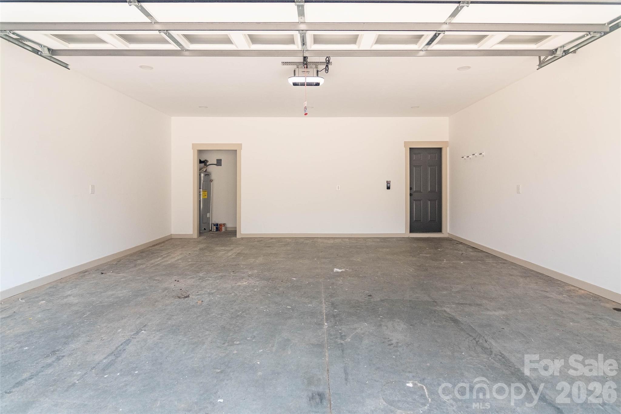 Great sized double car garage that handily holds two vehicles with extra room for lots of shelving and stuff.! - 98 Lexxi Lane, Tryon