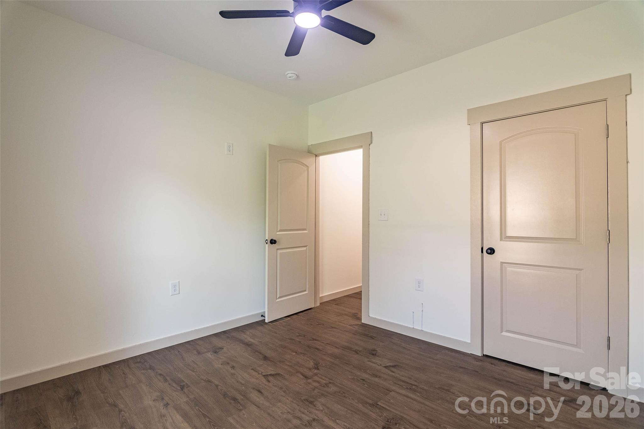 Third bedroom on the opposite side of the house from the primary. Same beautiful flooring and a good size closet! - 98 Lexxi Lane, Tryon