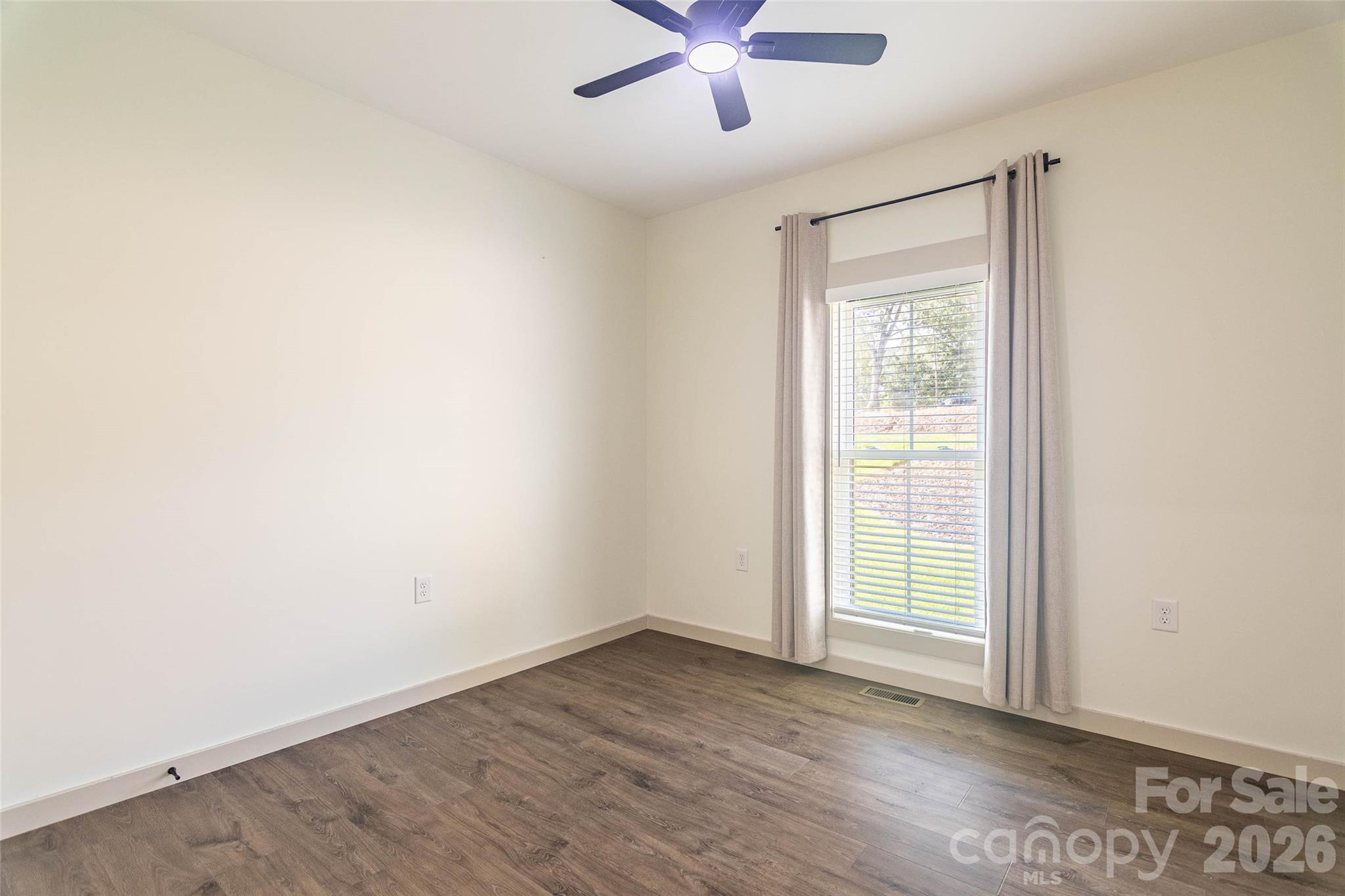 Third bedroom on the opposite side of the house from the primary. Same stylish custom blinds and draperies! - 98 Lexxi Lane, Tryon