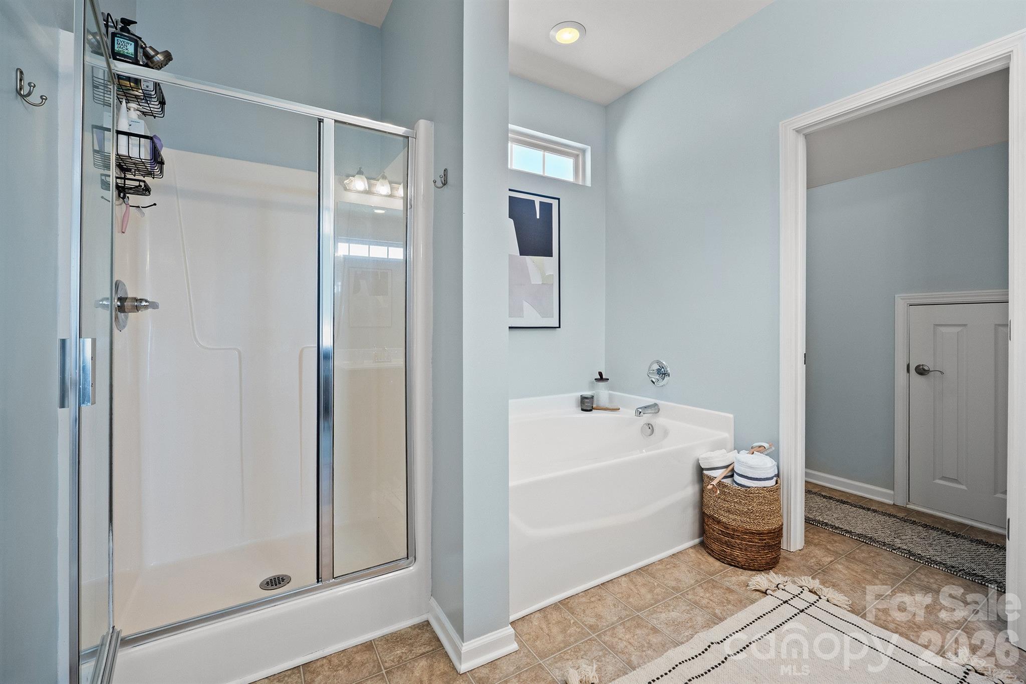 Primary bath with shower and garden tub - 14525 Holly Springs Drive, Huntersville