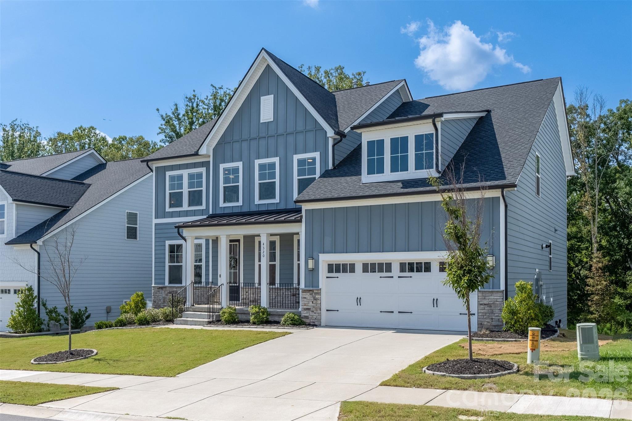 Front elevation with two-car garage - 4320 Tournette Drive, Indian Land