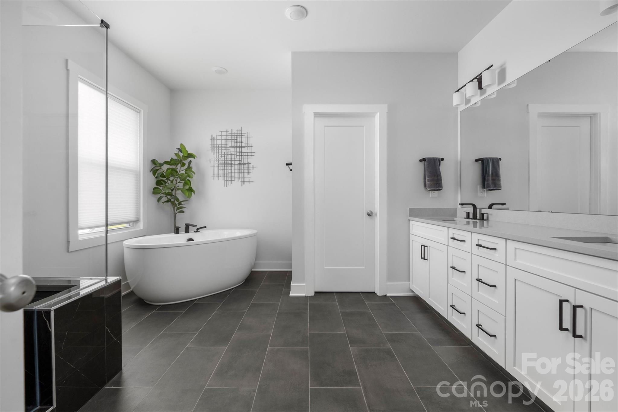 Primary bath with dual vanity, soaking tub, and walk-in shower - 4320 Tournette Drive, Indian Land